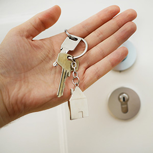 hand holding house keys